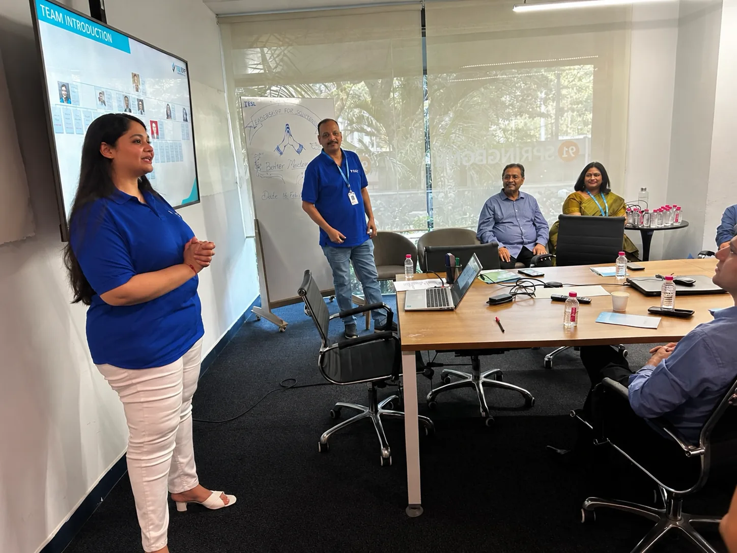 IESL Leadership speaking with the TEZ team during a company meeting